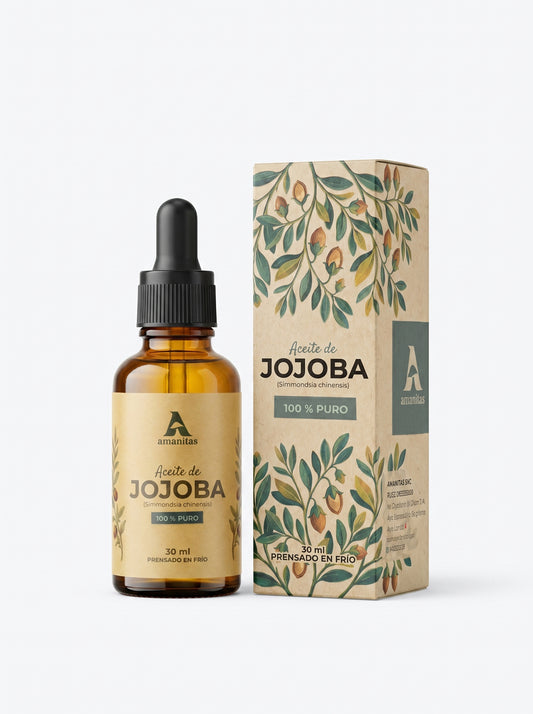 Frasco gotero de 30 ml de Aceite de Jojoba 100% puro junto a su empaque exterior con ilustraciones botánicas de la especie Simmondsia chinensis. El diseño de la etiqueta destaca el proceso de extracción en frío, reflejando la pureza y calidad de la marca Amanitas