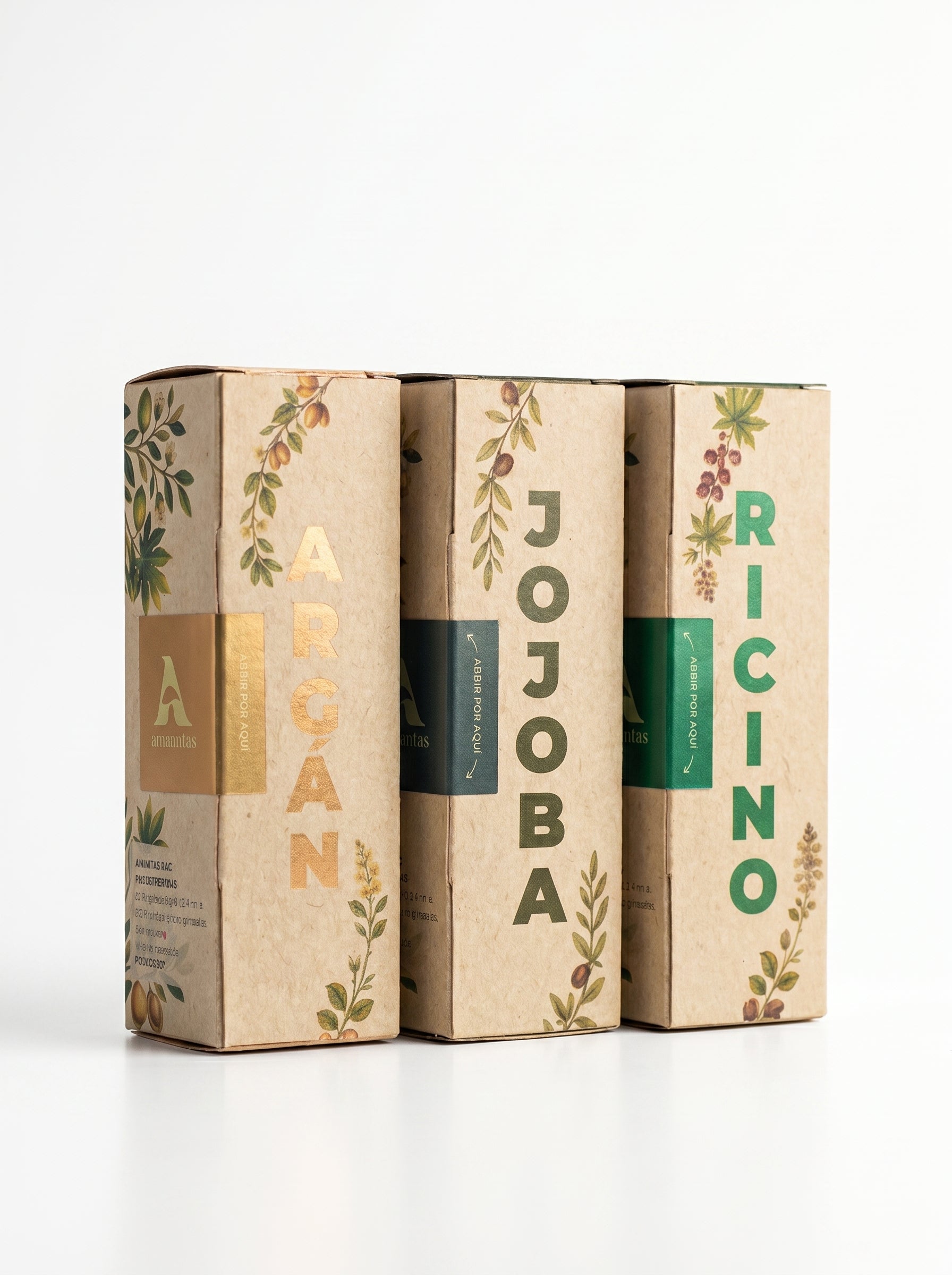 Set de tres aceites naturales de la marca Amanitas: Argán, Jojoba y Ricino. Los empaques de cartón con diseño de ilustraciones botánicas muestran la presentación premium y ecológica de la colección de aceites prensados en frío