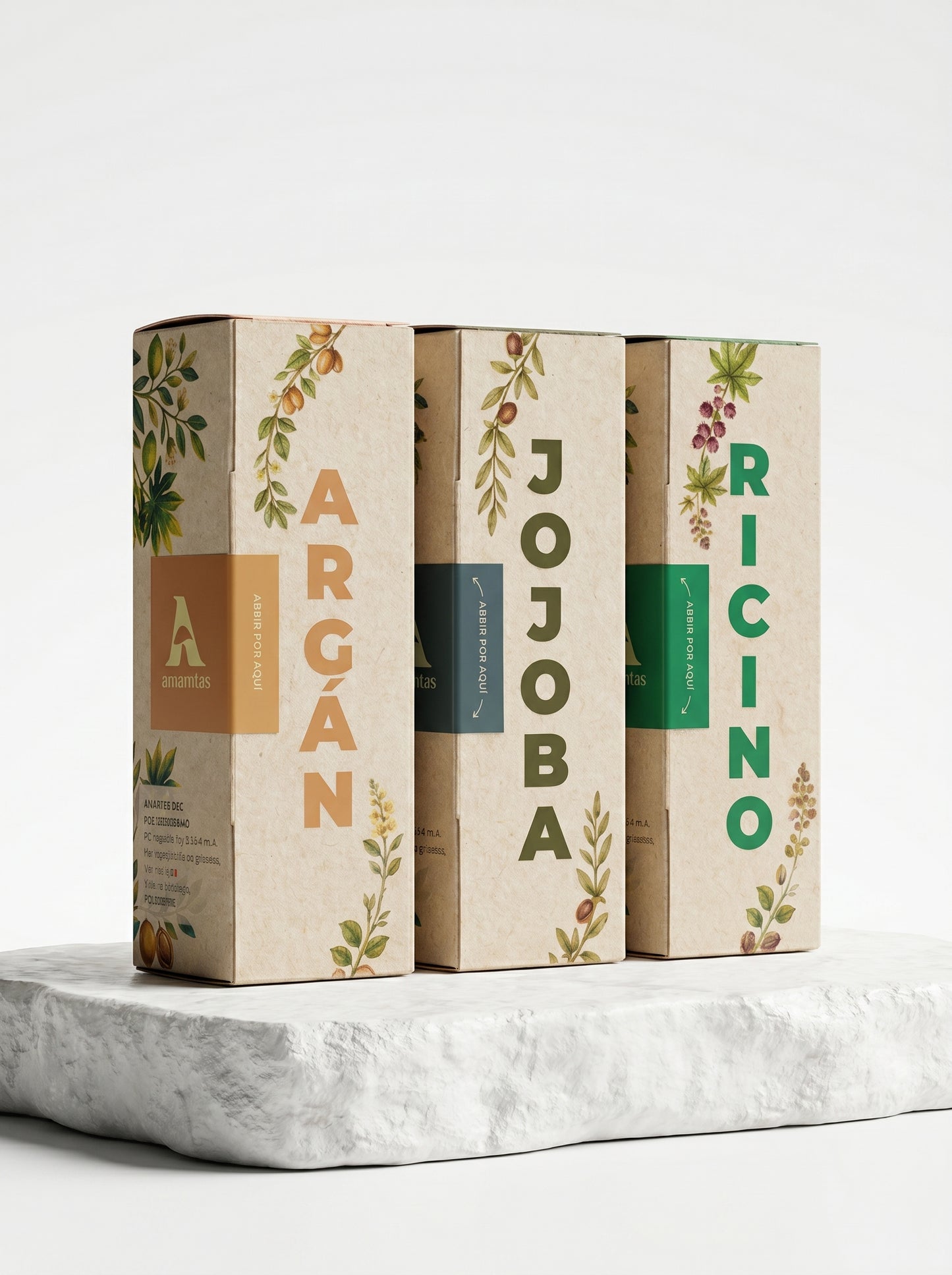 Set de tres aceites naturales de la marca Amanitas: Argán, Jojoba y Ricino. Los empaques de cartón con diseño de ilustraciones botánicas muestran la presentación premium y ecológica de la colección de aceites prensados en frío sobre una base de piedra.